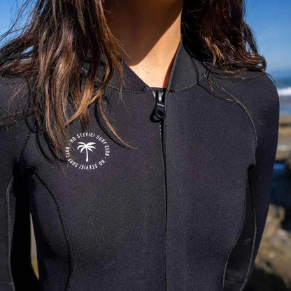 Woman wearing a black springsuit wetsuit